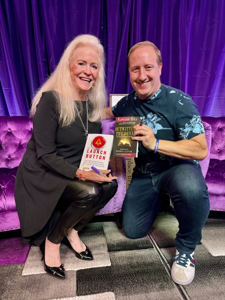 Hugh Zaretsky and Sharon Lechtor hanging out off stage exchanging books. Hugh's autographed and inscribed Launch Button Book for Sharon's autographed and inscribed Out Whitting the Devil book.