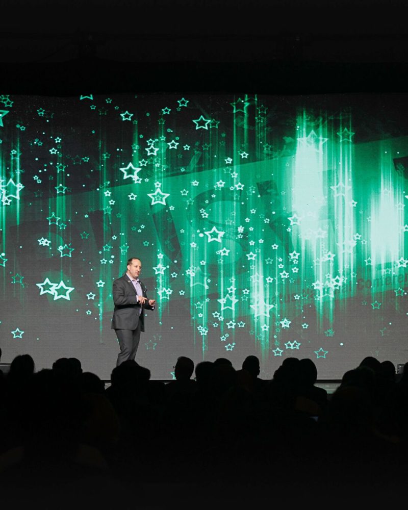HughSpeakingGreenStarsBackground